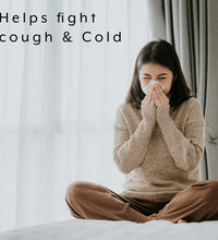 benefits of immune support showing woman coughing to show it helps fight cough and cold
