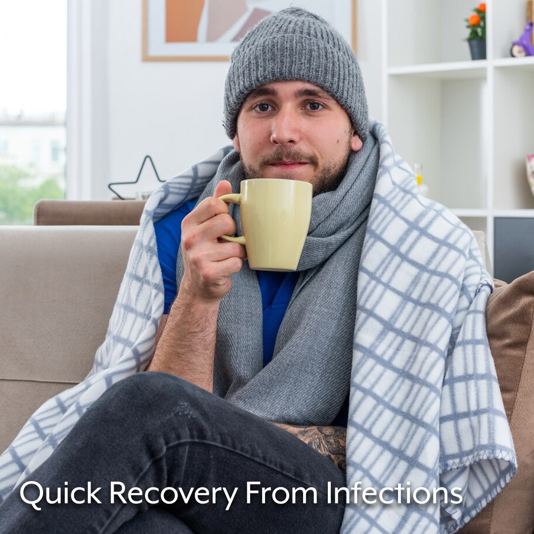 benefits of immune support showing man recovering quickly from infection and sipping tea