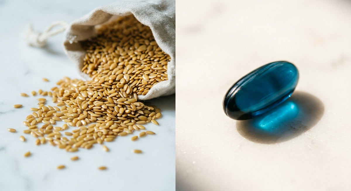 A close-up editorial shot of golden flaxseeds beside a fish oil softgel capsule on a white marble surface, highlighting the contrast between plant and marine omega-3 sources.